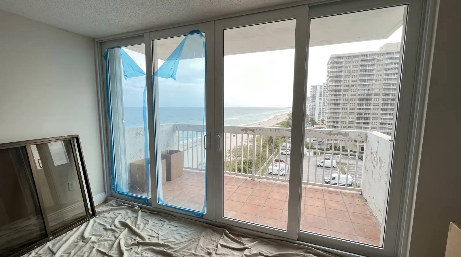 Impact sliding glass doors on a condo balcony in Hallandale Beach, FL