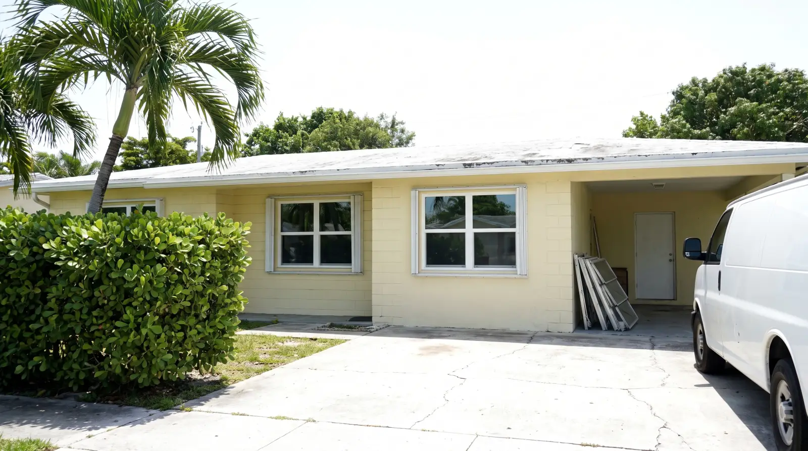 New impact windows on a 1950s concrete-block ranch home in Hollywood, FL