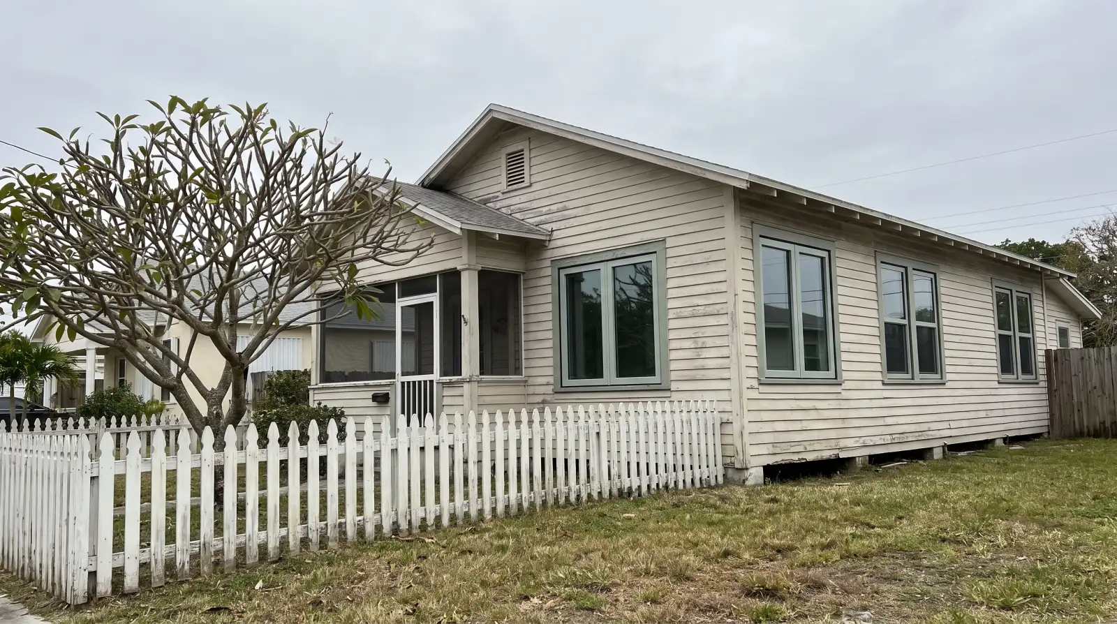 Impact windows on a 1920s frame cottage in Lake Worth Beach, FL