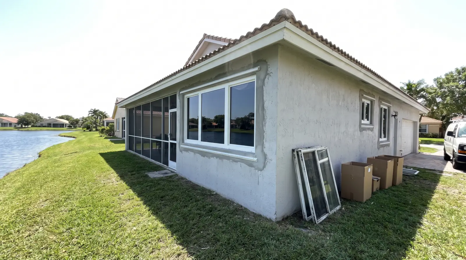 Impact windows on a lakefront home in Miami Lakes, FL