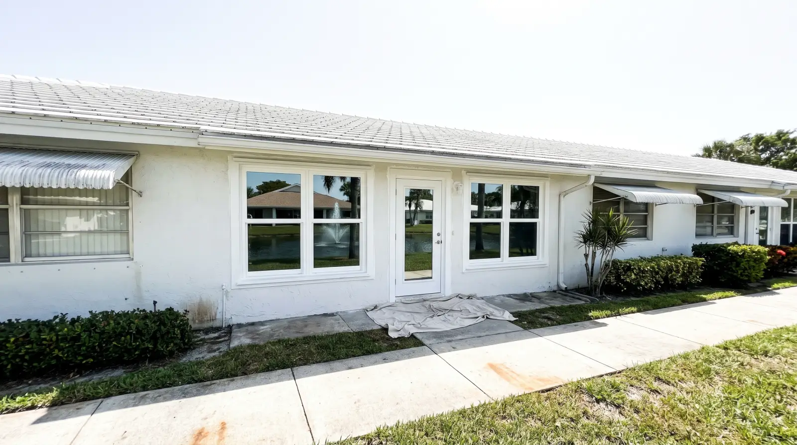 Impact windows on a one-story villa in Tamarac, FL