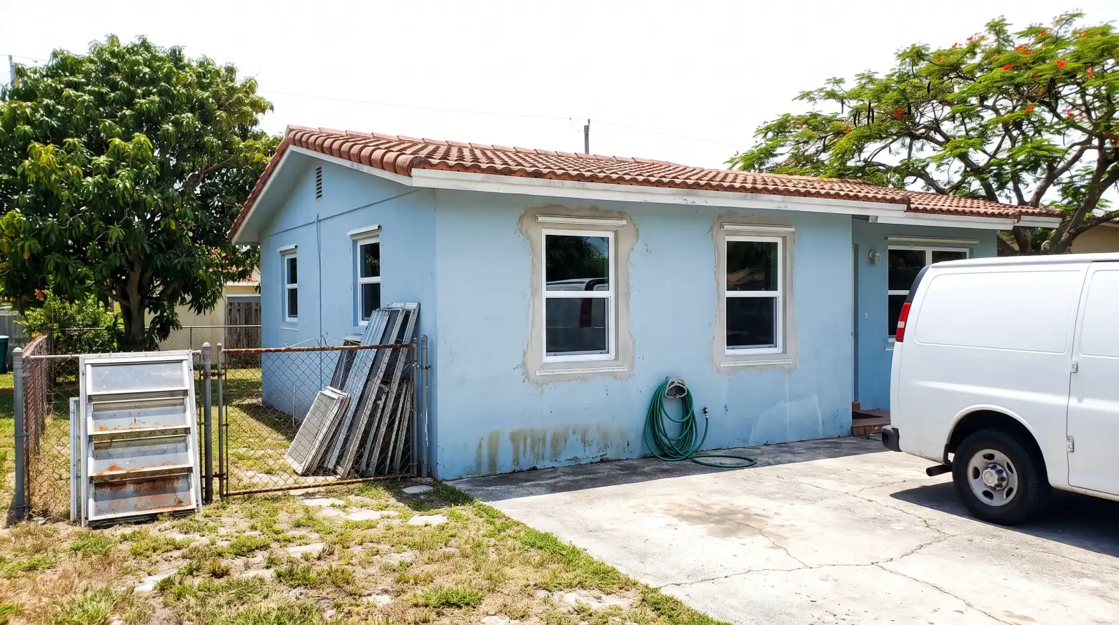 Impact windows on a 1960s single-family home in West Park, FL