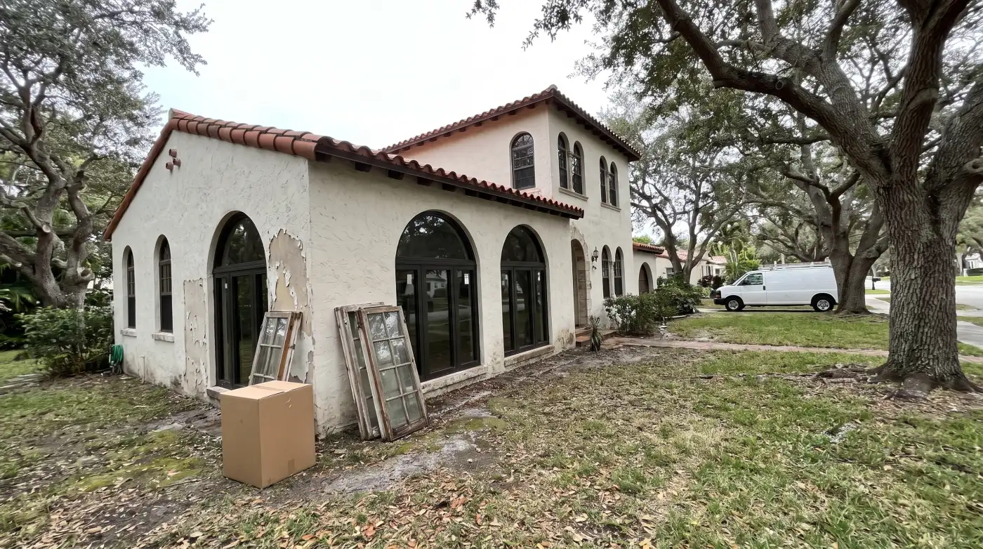 Impact windows being installed on a Mediterranean Revival home in Boca Raton, FL