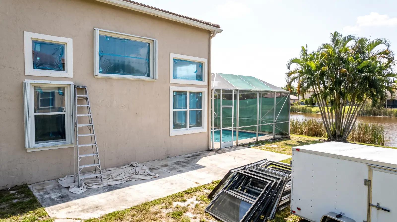 Impact windows being installed on a 1990s home in Miramar, FL