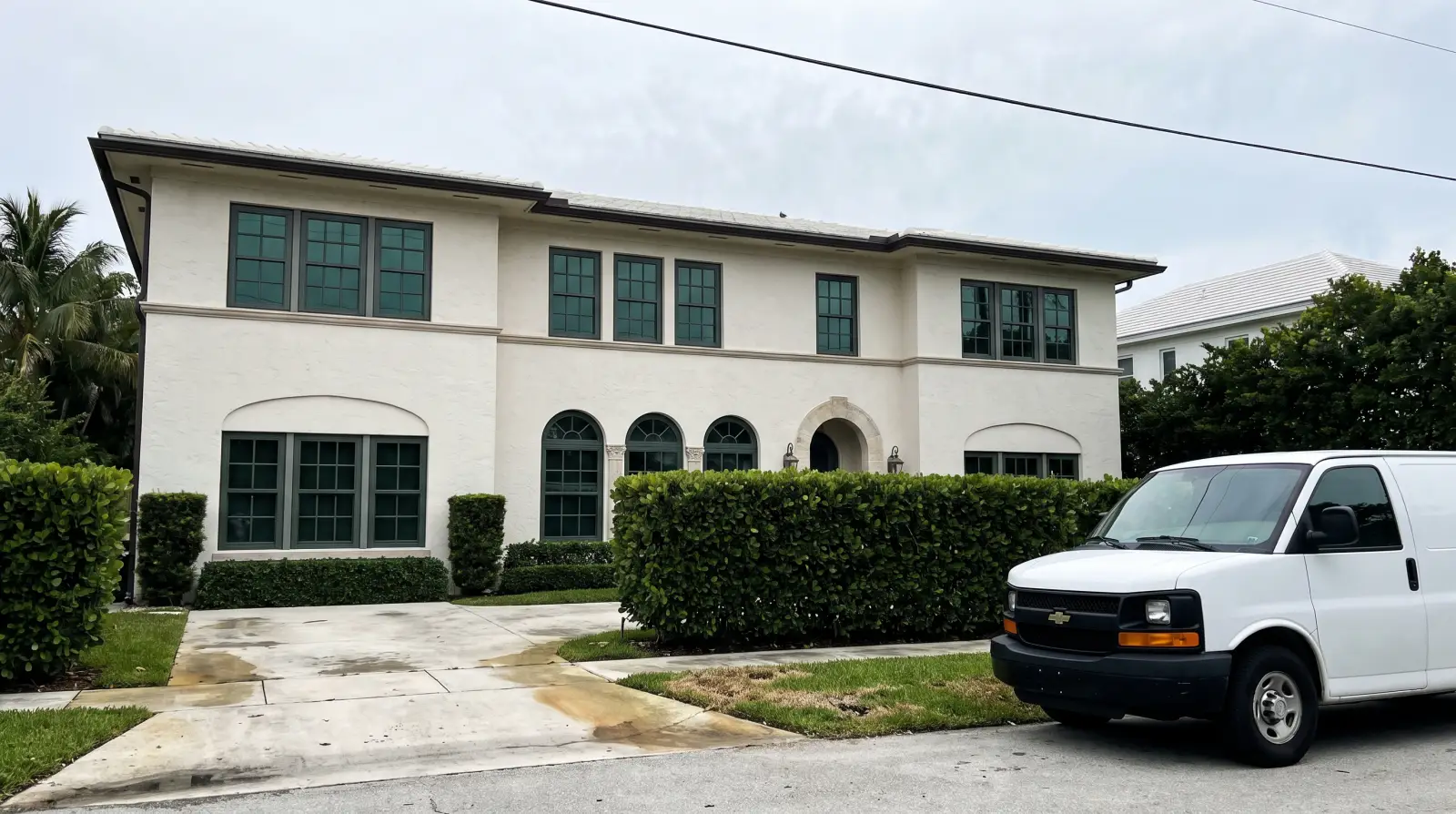 Impact windows on a Mediterranean Revival home in Palm Beach, FL