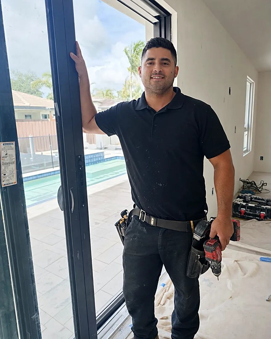 Finished impact window in a bright South Florida living room with a happy homeowner